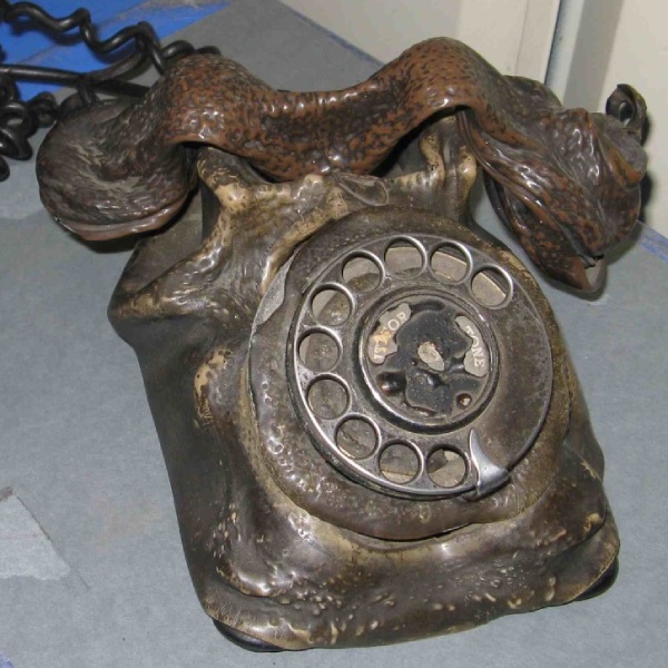 Contact Calluna Consulting. Brown Bakelite telephone which has partially melted in a fire